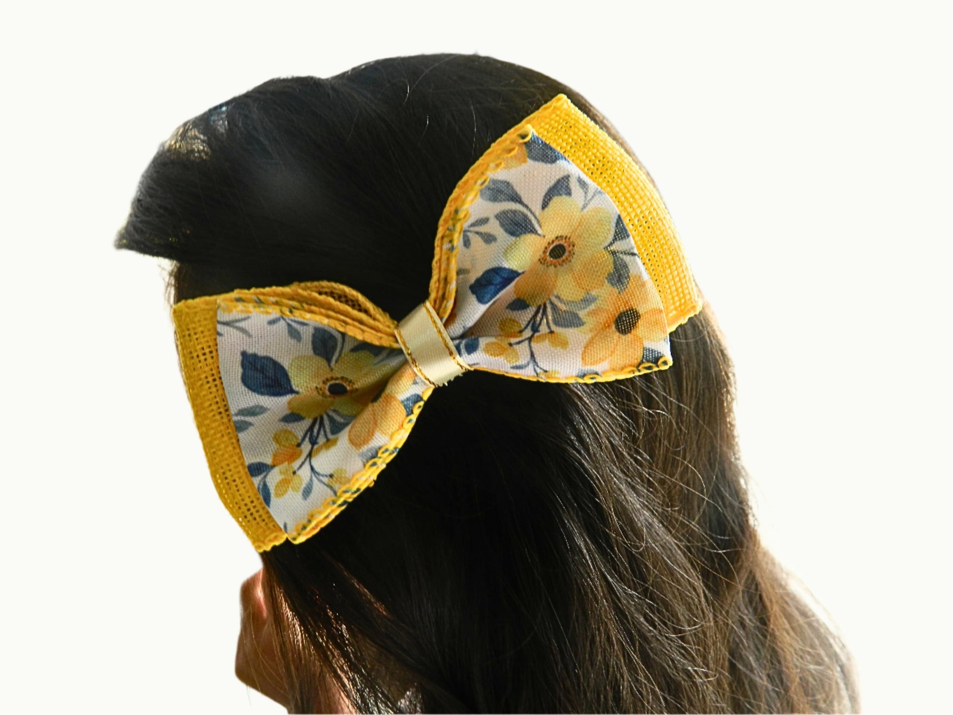 yellow flower dual fabric bow on a girl